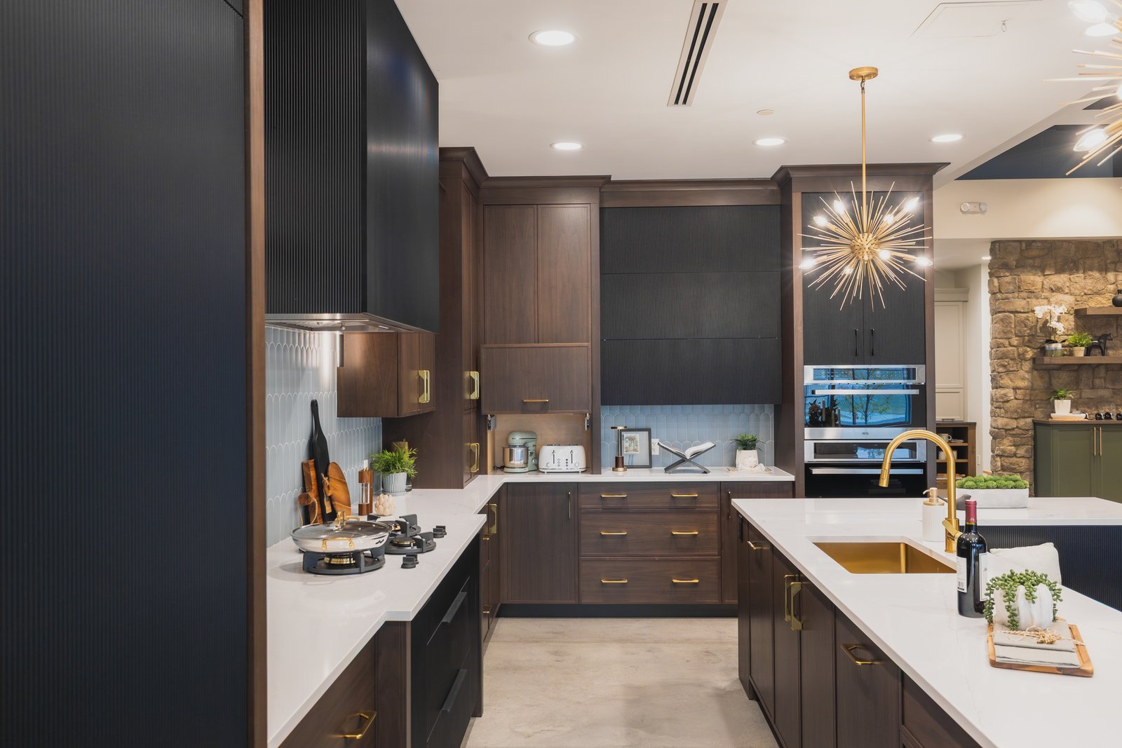 Bjornson Designs showroom kitchen display with a PITT Cooking countertop-integrated gas burner system